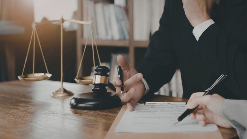 attorney discussing trust paperwork with client