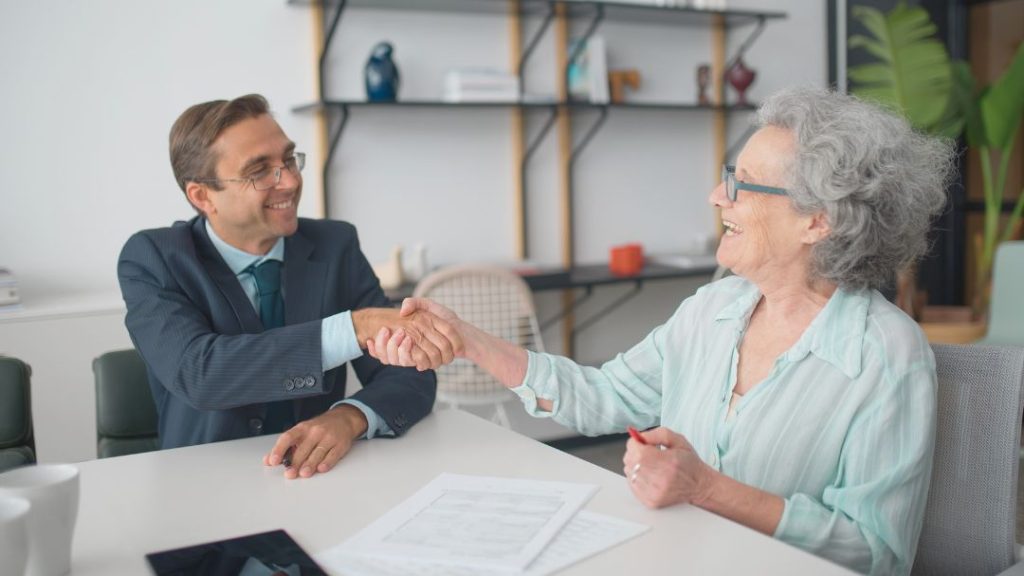 professional man meeting with elderly woman